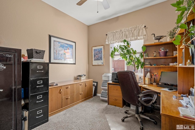 office area with a ceiling fan and light colored carpet