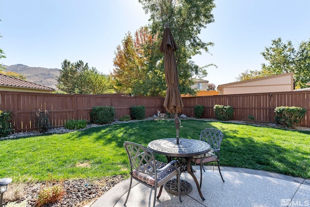 view of patio / terrace with a mountain view