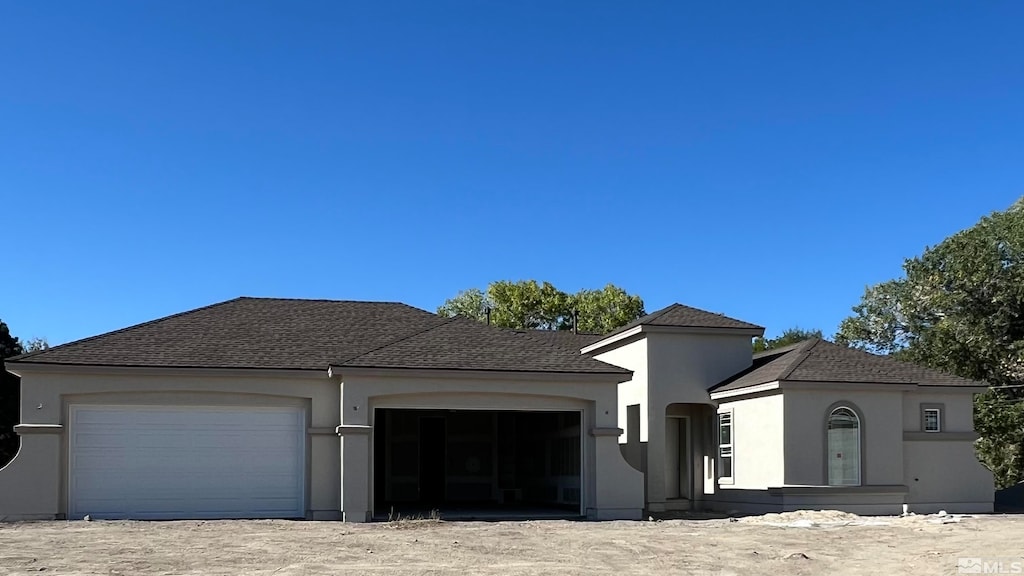 view of front of property with a garage