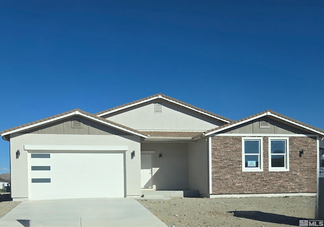 ranch-style home featuring a garage