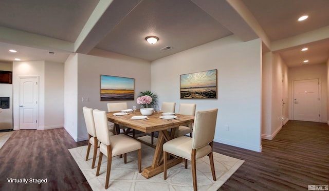 dining space with hardwood / wood-style floors