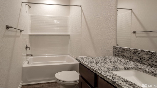 full bathroom with vanity, shower / bath combination, hardwood / wood-style floors, and toilet