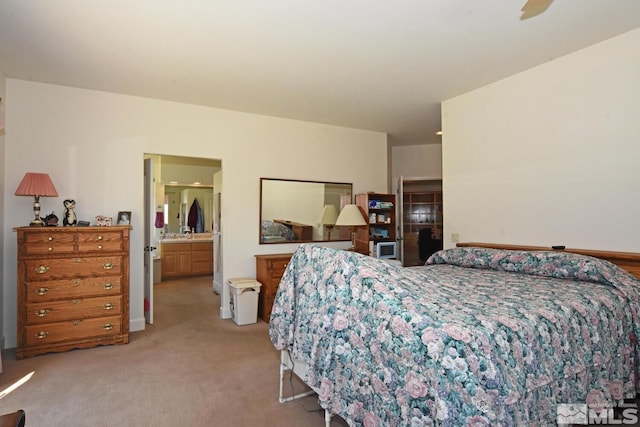 carpeted bedroom with connected bathroom