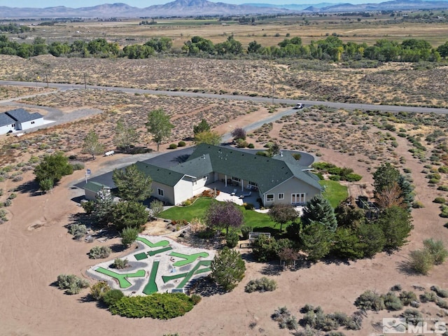 drone / aerial view featuring a mountain view