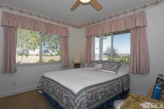 bedroom with multiple windows, carpet floors, and ceiling fan