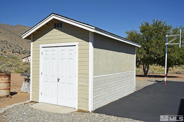 view of outdoor structure featuring a mountain view