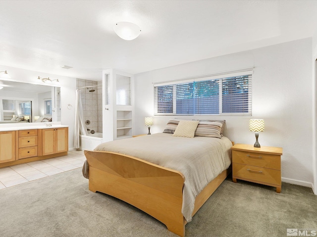 bedroom featuring light carpet