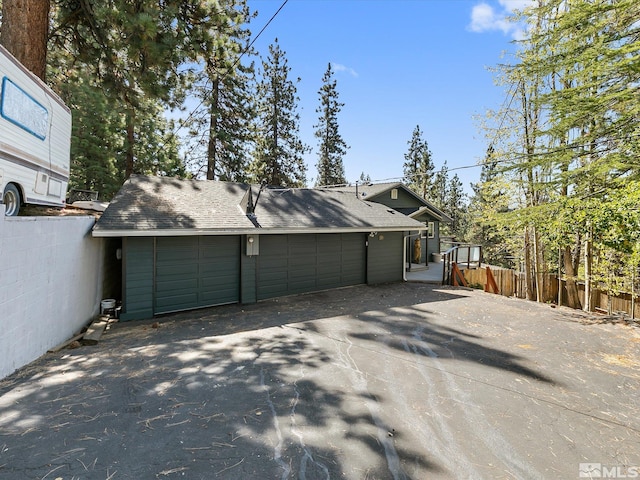 view of side of home featuring a garage