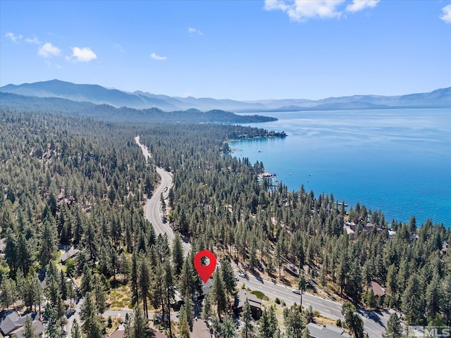 aerial view featuring a water and mountain view