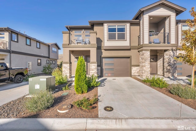 view of front of home featuring a balcony and a garage