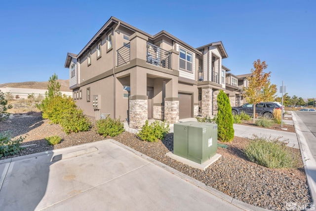 view of front of home with a balcony