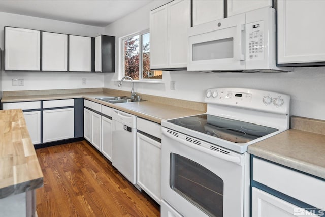 kitchen with dark hardwood / wood-style flooring, sink, white cabinetry, white appliances, and wooden counters