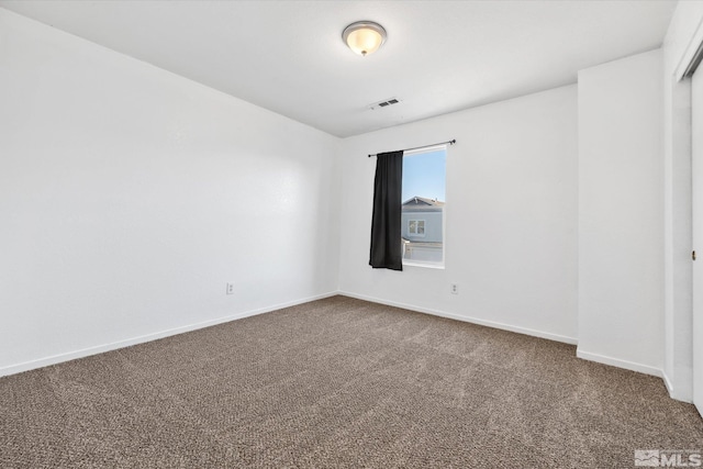 empty room featuring carpet flooring