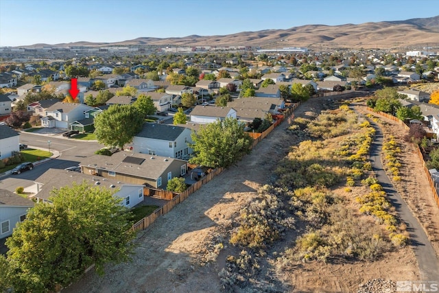 drone / aerial view featuring a mountain view