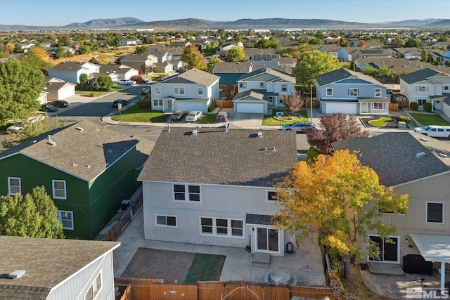 birds eye view of property with a mountain view