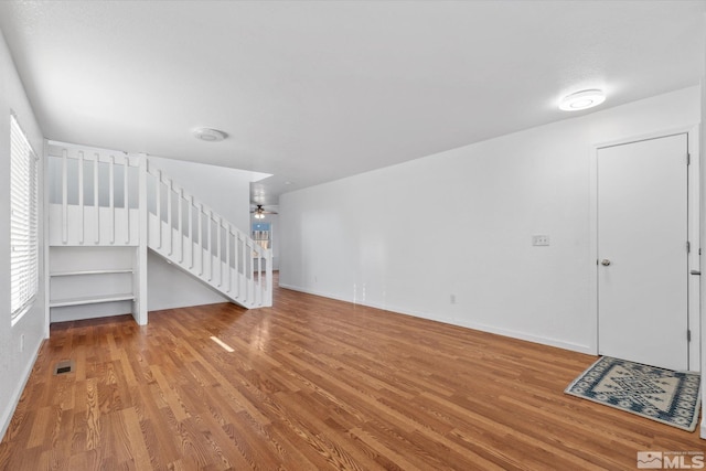 interior space with ceiling fan and hardwood / wood-style floors