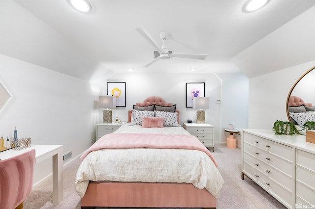 carpeted bedroom with vaulted ceiling and ceiling fan