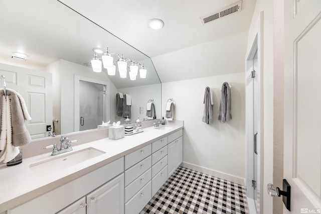 bathroom featuring vanity and a shower with shower door