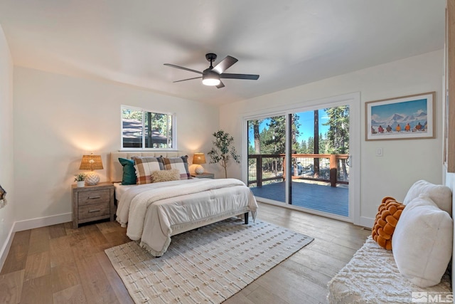 bedroom featuring light wood-type flooring, ceiling fan, and access to outside