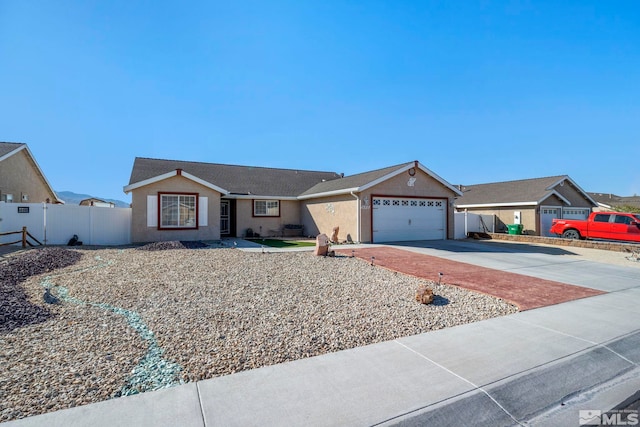 ranch-style home featuring a garage