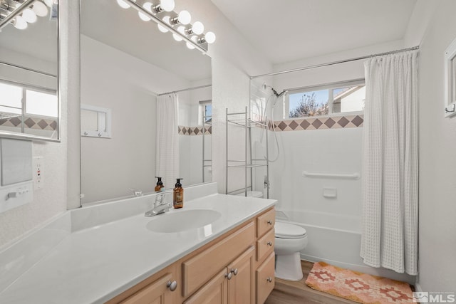 full bathroom with wood-type flooring, vanity, toilet, and shower / bath combo with shower curtain