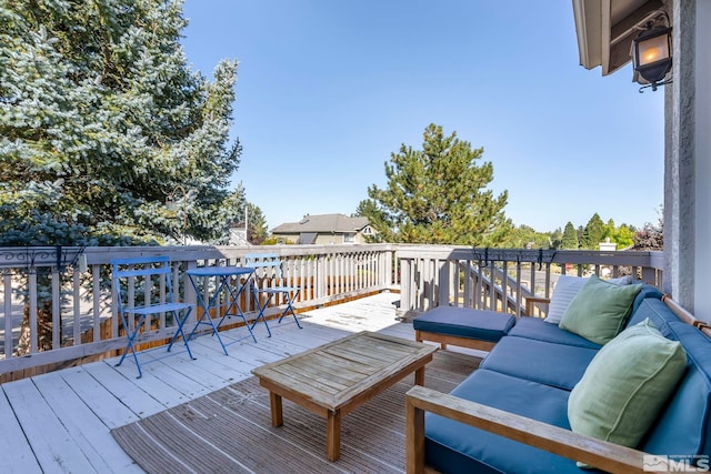 wooden deck featuring an outdoor living space