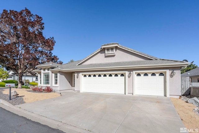 ranch-style home with a garage