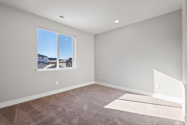 empty room featuring carpet floors