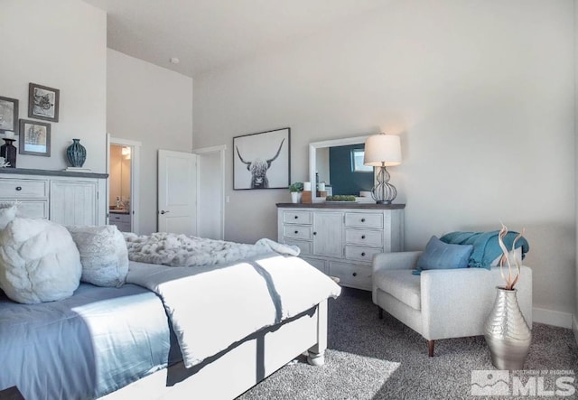 carpeted bedroom featuring high vaulted ceiling