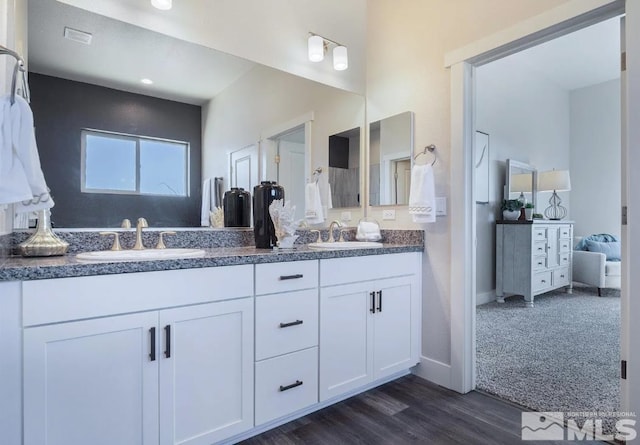 bathroom featuring vanity and hardwood / wood-style flooring