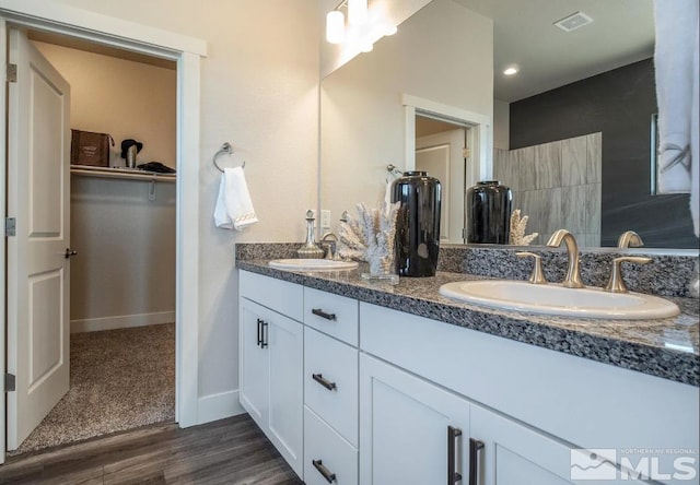 bathroom featuring vanity and hardwood / wood-style flooring