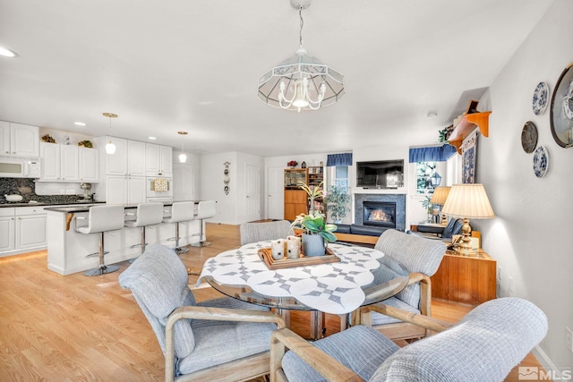 dining space with light wood-type flooring