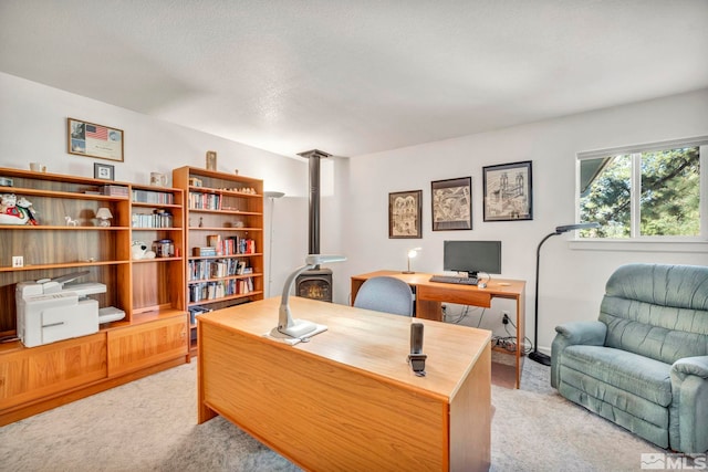 carpeted office with a textured ceiling