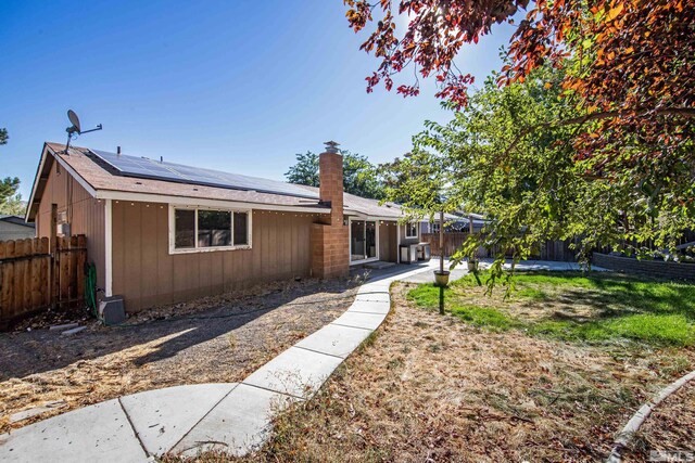 view of front of house with solar panels