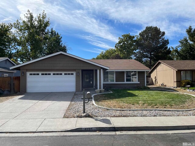 ranch-style house with a garage and a front yard