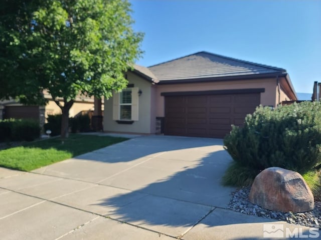 single story home featuring a garage