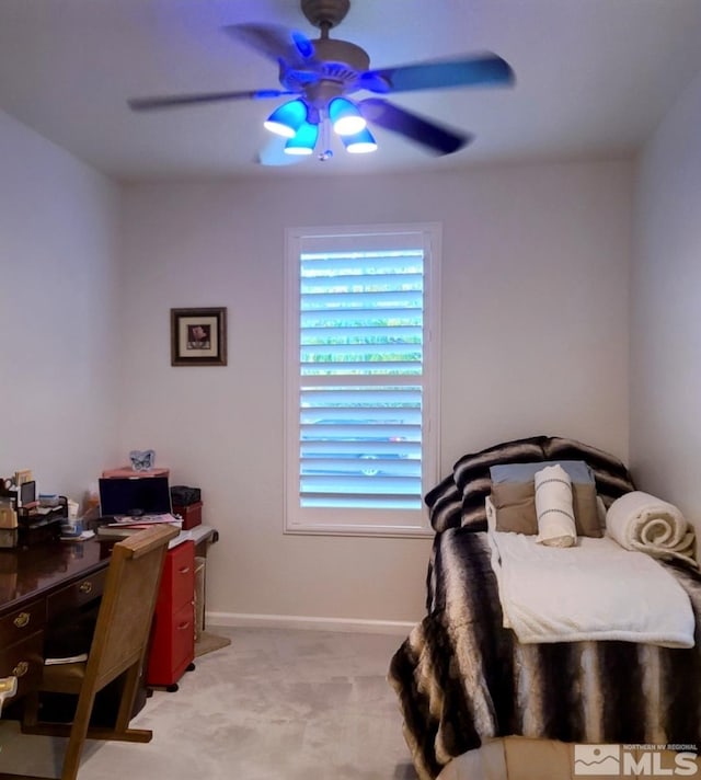 bedroom with ceiling fan and light colored carpet