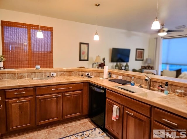 kitchen with ceiling fan, dishwasher, hanging light fixtures, and sink