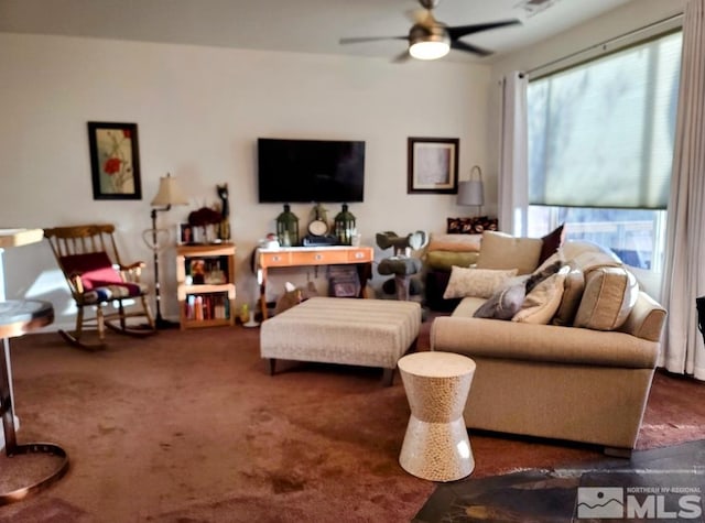 carpeted living room featuring ceiling fan