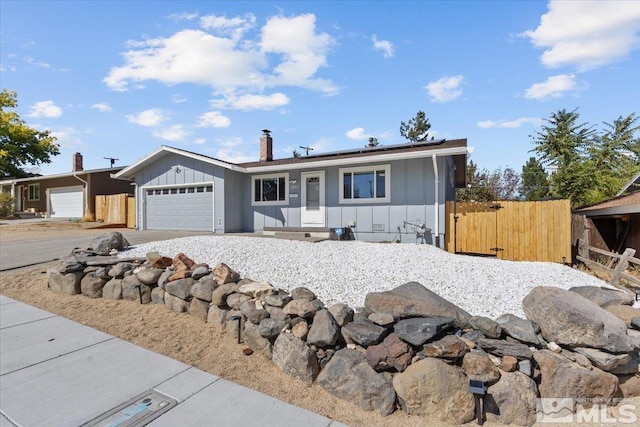 ranch-style home featuring a garage