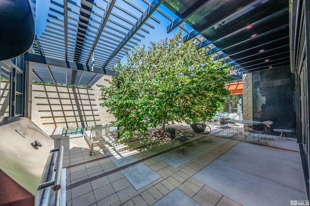 view of patio / terrace featuring a pergola and a grill