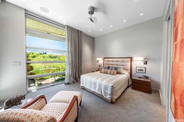 bedroom with light colored carpet