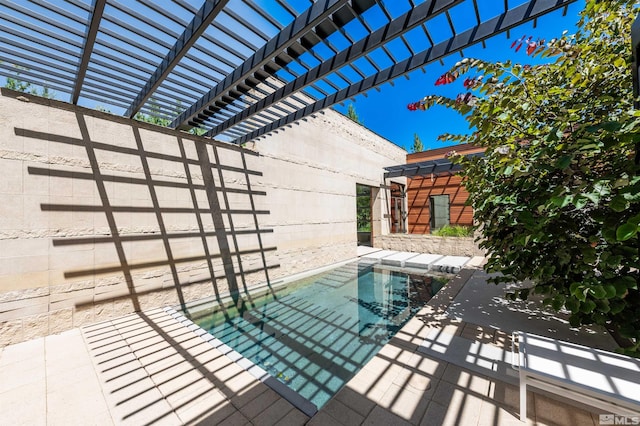 view of pool featuring a pergola and a patio area