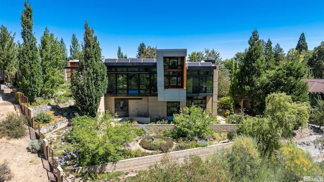 back of property featuring a sunroom