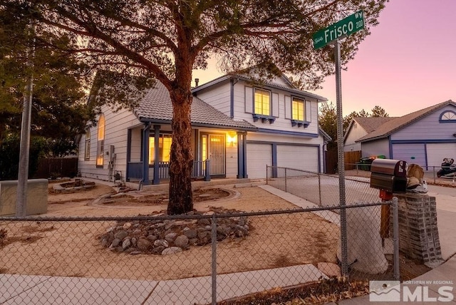 front of property with a garage