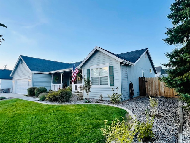 ranch-style house with a garage and a front lawn