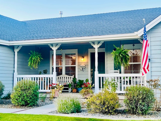 entrance to property featuring covered porch