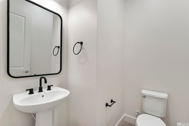 bathroom with sink and toilet