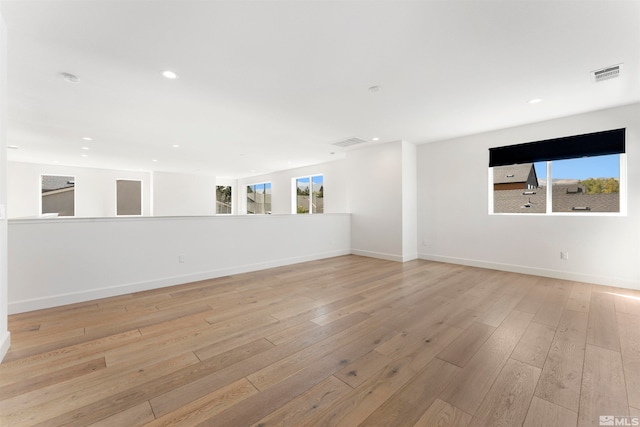 spare room featuring light wood-type flooring