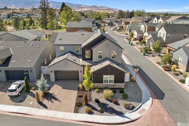 birds eye view of property featuring a mountain view